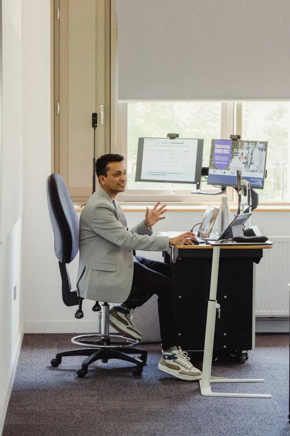 Piyush Agarwal at his desk, mid-explanation during a working session.